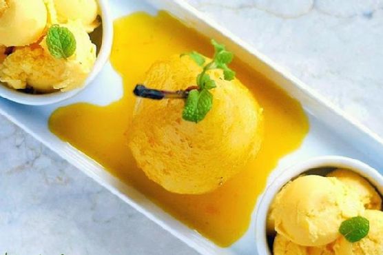 Classy Poached Pear In Spicy Mango Nectar With Mango Ice Cream